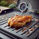 Flattop Chicken breast cooking on a griddle with thermometer