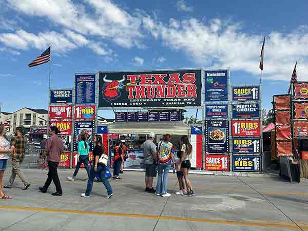 Texas Thunder booth with large bull sign and menu boards at 2025 Rib Cook-Off