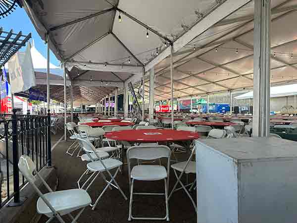 Seating under large tent in Rib Village at 2025 Rib Cook-Off