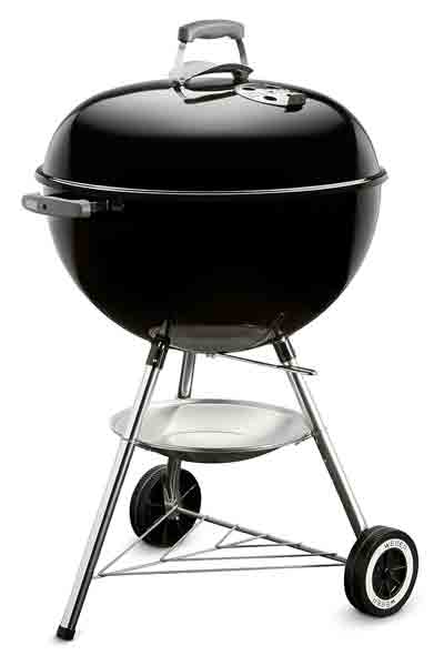 Iconic black Weber Kettle charcoal grill with domed lid, a key invention in American BBQ history by George Stephen Sr. for 1952 backyard smoking revolution.