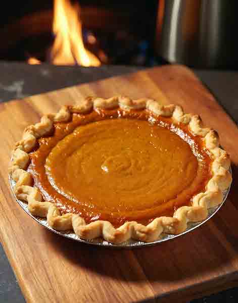 Spiced pumpkin pie baked on Big Green Egg – easy Thanksgiving dessert recipe with flaky crust