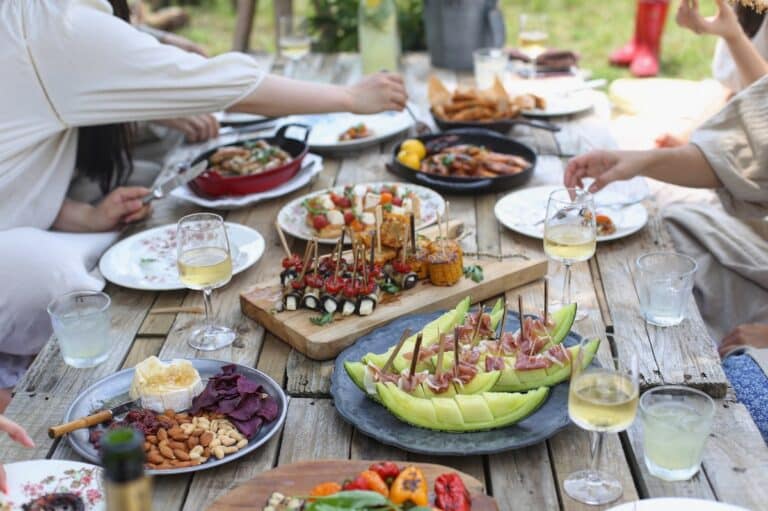 National BBQ Day backyard cookout — friends gathered around the table on May 16