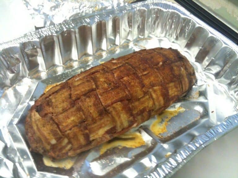 A bacon-wrapped meatloaf with a glazed crust — smoked meatloaf