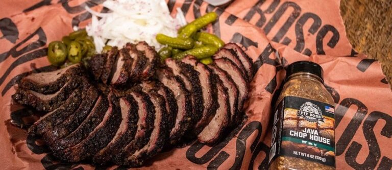 Sliced smoked tri tip with a deep smoke ring and dark crust