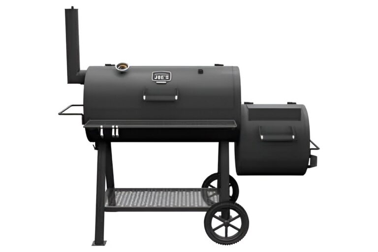 Black Oklahoma Joe's offset smoker with firebox, pivotal in American BBQ history as Joe Davidson's mid-20th-century design for Texas low-and-slow brisket.